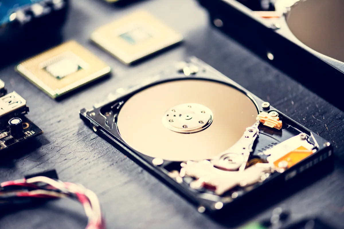 Close-up of an open hard disk drive platter and read head